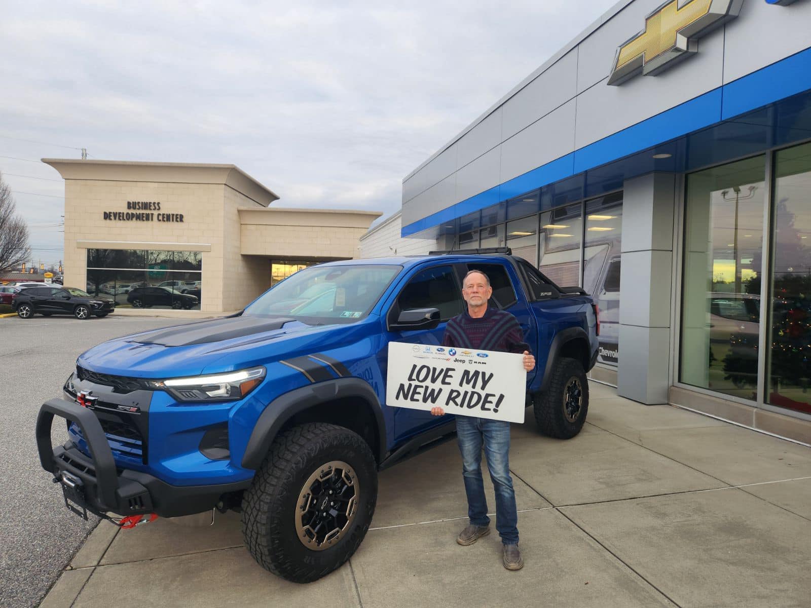 happy customer with new Chevy