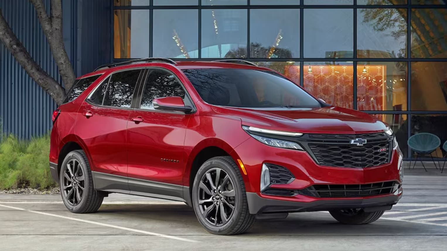 2024 EQUINOX IN RED PARKED OUTSIDE
