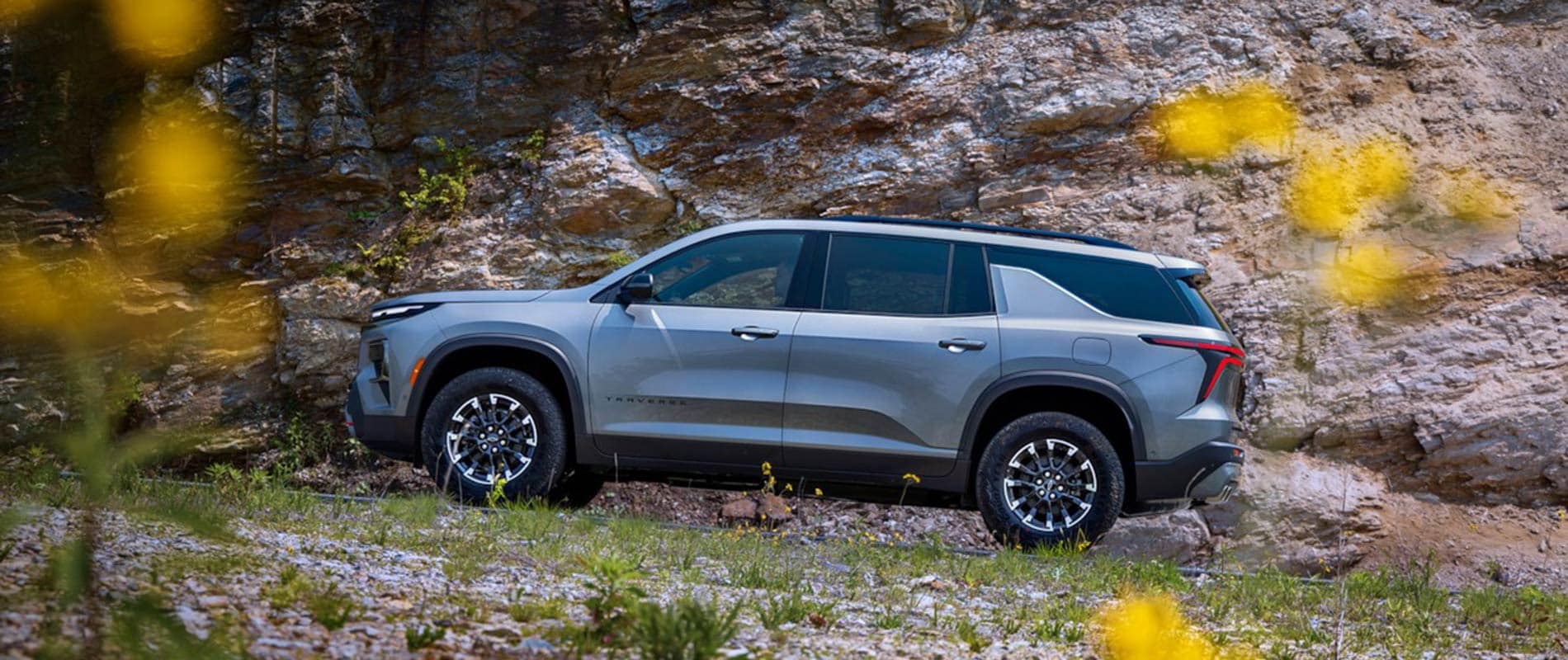 2026 Chevrolet Traverse driving up a mountain side