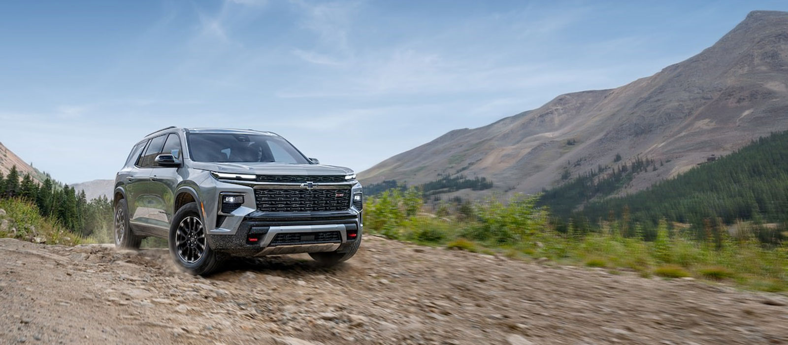 2025 Chevrolet Traverse driving on a mountain path