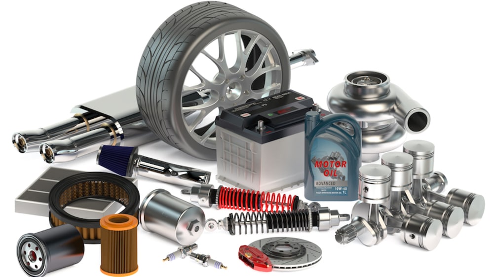 A selection of automotive parts arranged on a white background