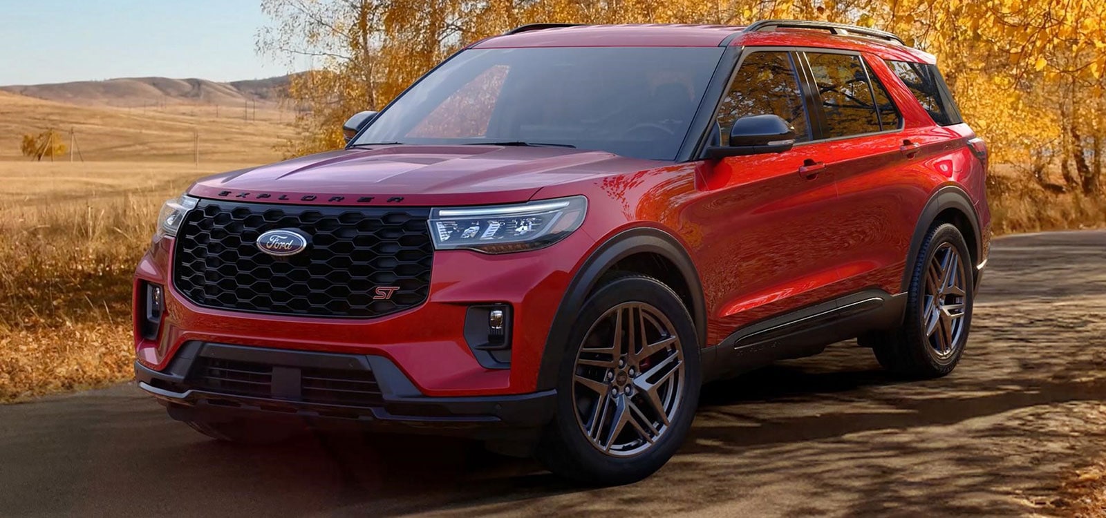 Red 2026 Ford Explorer parked on a country road