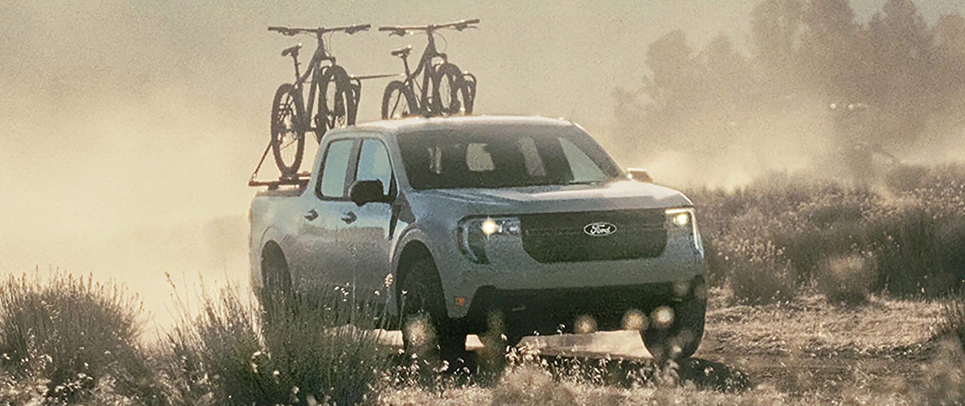2025 Ford Maverick driving with two bikes in the bed