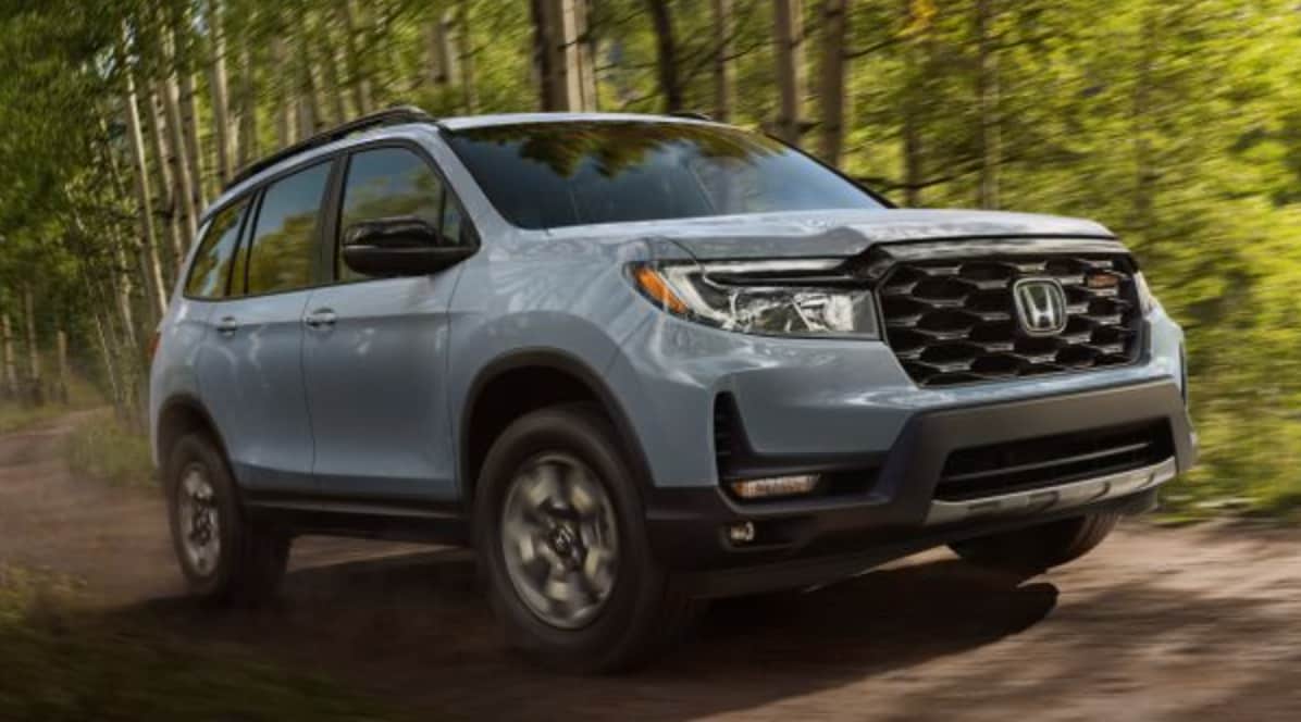 Honda Passport Driving in the Woods