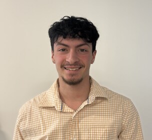 Staff member Elijah Cruz from ID_1a01e7384f61