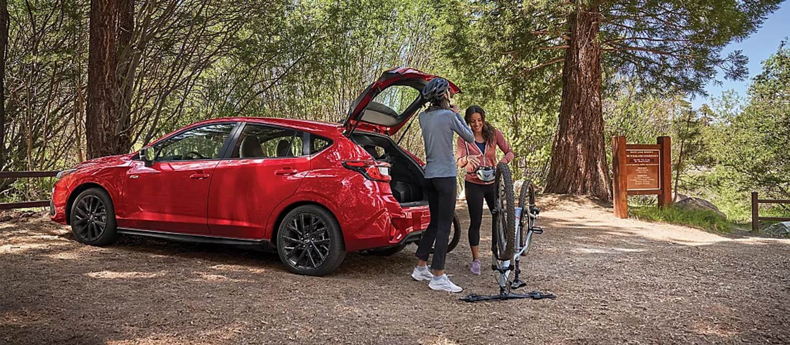 Bikers preparing beside their 2025 Subaru Impreza