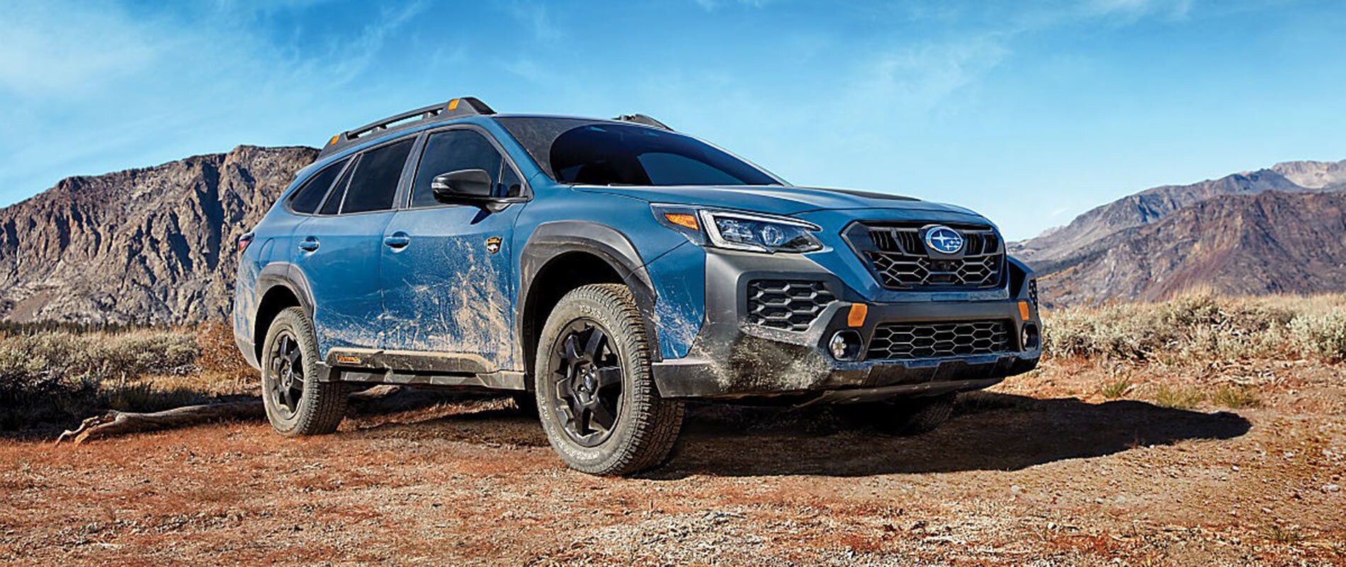 Blue 2025 Subaru Outback covered in mud
