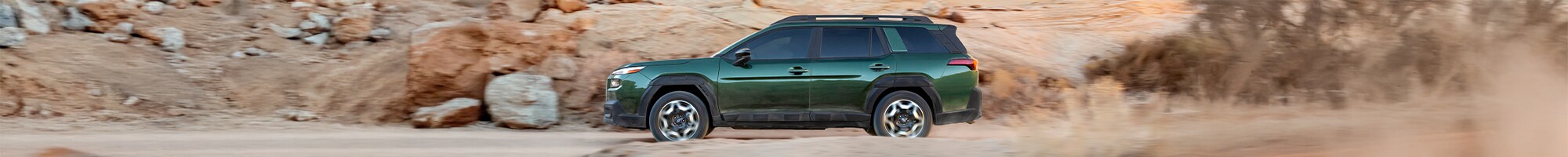  2026 Subaru Outback driving on dirt path