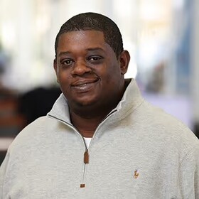 Staff member Frantz Napoleon from ID_009801