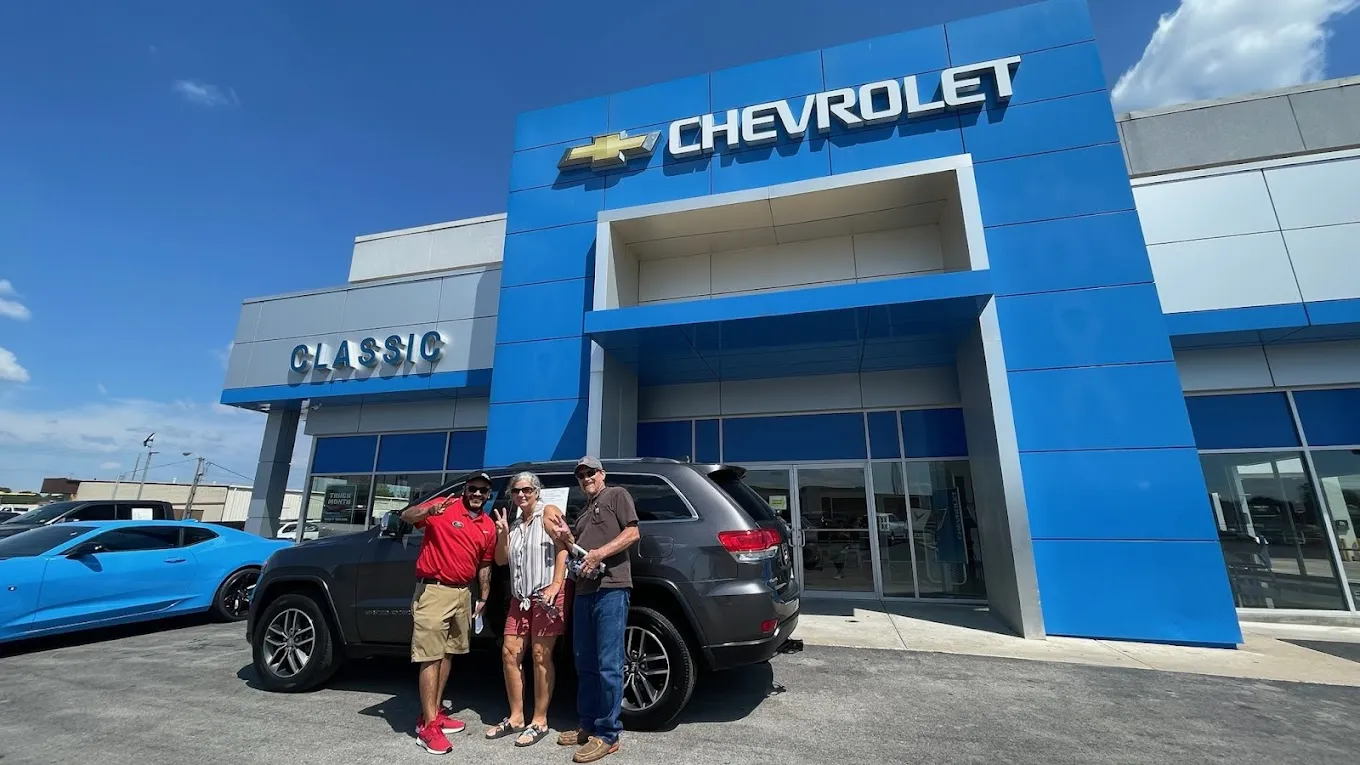 Family after purchasing a vehicle at Classic Chevrolet in Owasso, OK