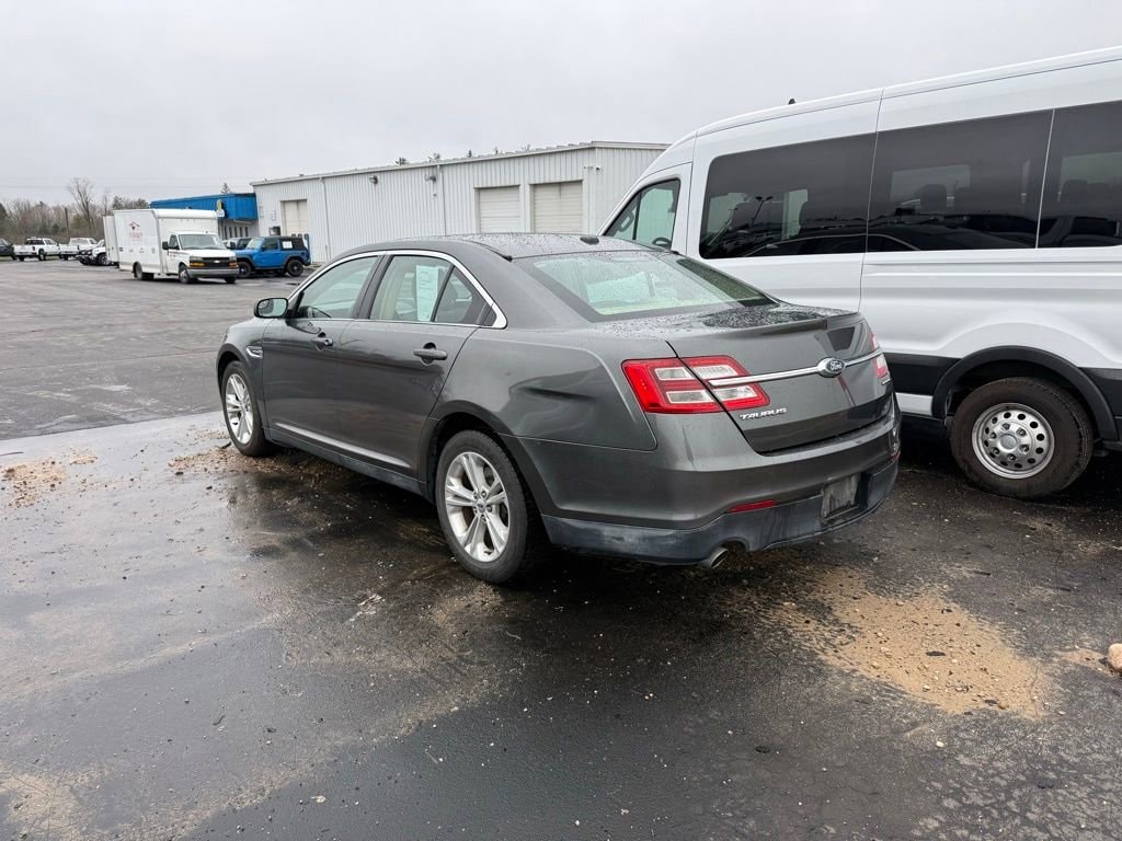 Used 2017 Ford Taurus SE with VIN 1FAHP2D82HG106582 for sale in Lake City, MI