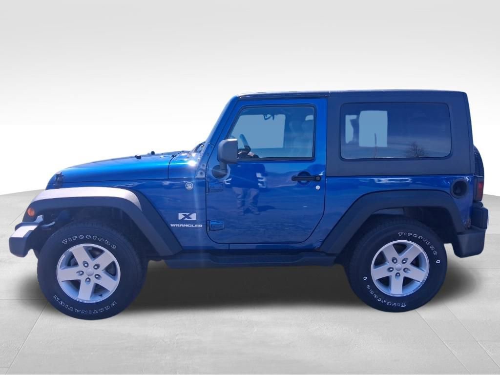 Used 2009 Jeep Wrangler X with VIN 1J4FA24179L789422 for sale in Lake City, MI