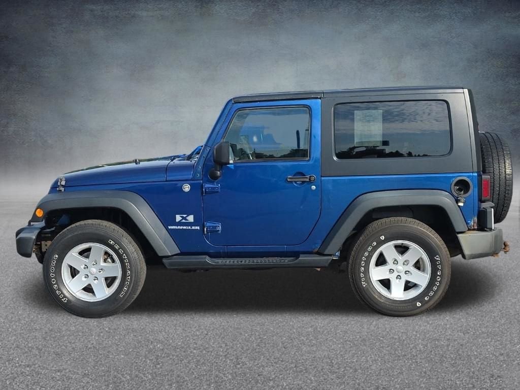 Used 2009 Jeep Wrangler X with VIN 1J4FA24179L789422 for sale in Lake City, MI