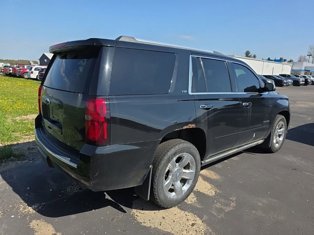 Used 2015 Chevrolet Tahoe LTZ with VIN 1GNSKCKC1FR111325 for sale in Lake City, MI