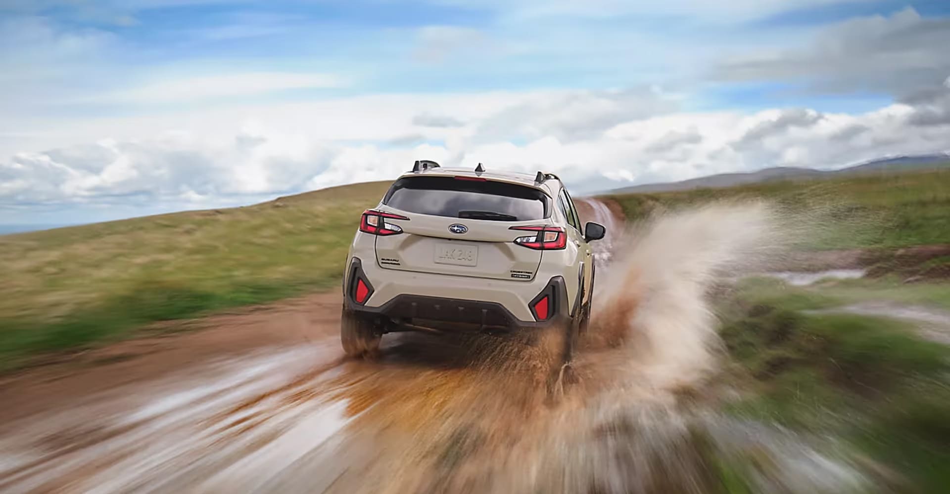 Subaru Hybrid driving on the road