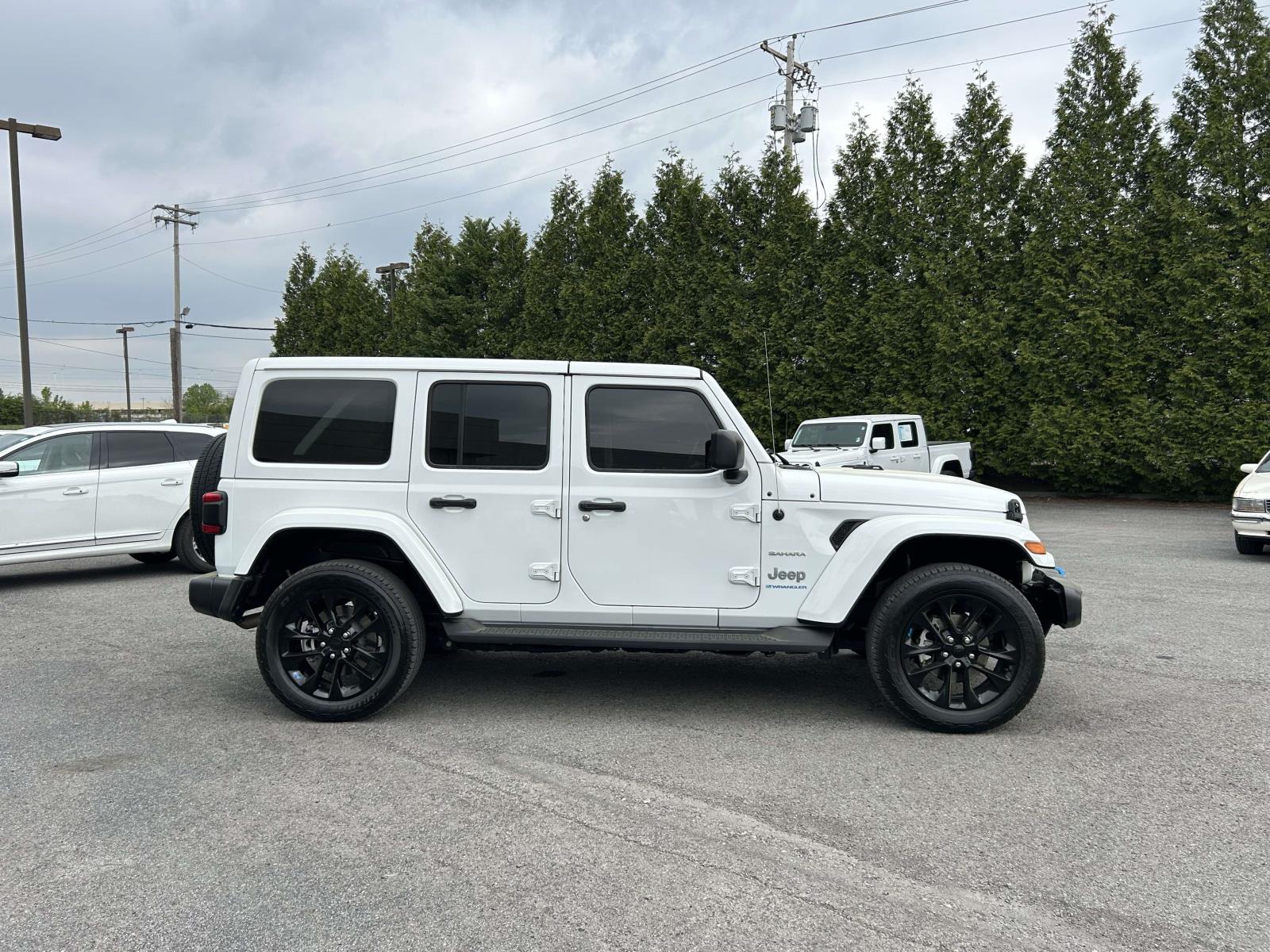 Used 2023 Jeep Wrangler 4xe Sahara 4XE with VIN 1C4JJXP67PW514424 for sale in Knoxville, TN