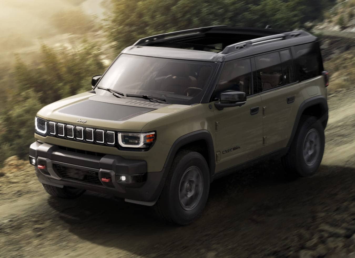 2026 Jeep Recon with rugged design driving on a dirt road surrounded by trees.