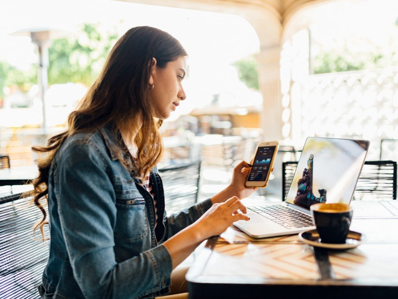 Young Customer Browsing The CloudLot Inventory On Her Laptop And Mobile