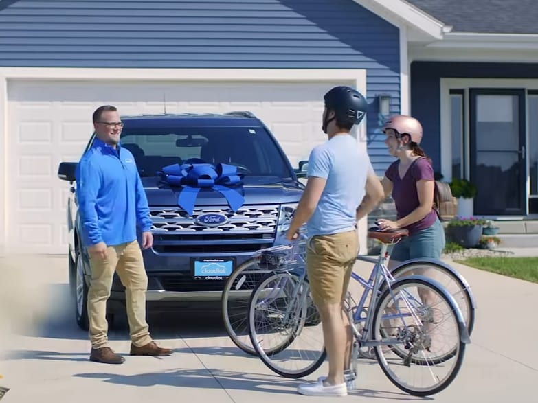 Cloudlot Salesperson Delivering a New SUV