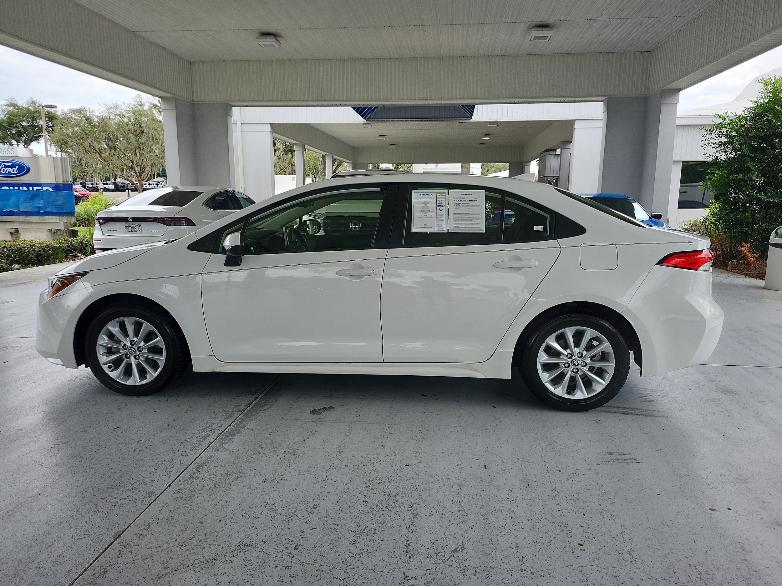 Used 2021 Toyota Corolla LE with VIN JTDHPMAE1MJ176572 for sale in Orange City, FL