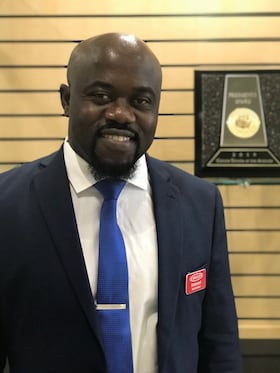 Staff member Emmanuel Ayemhenre from ID_013ef84b01e9
