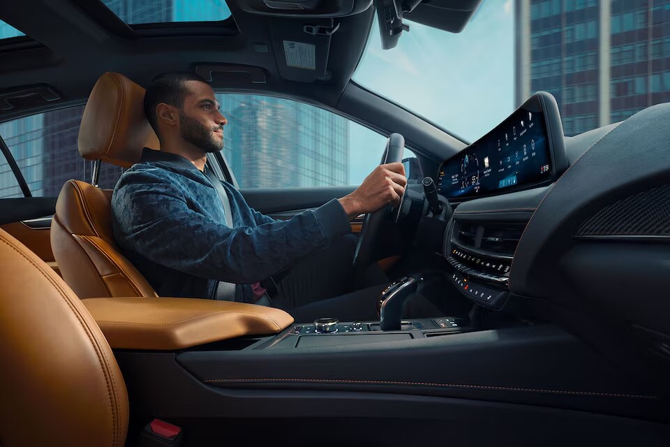 Guy driving a 2024 Cadillac SUV