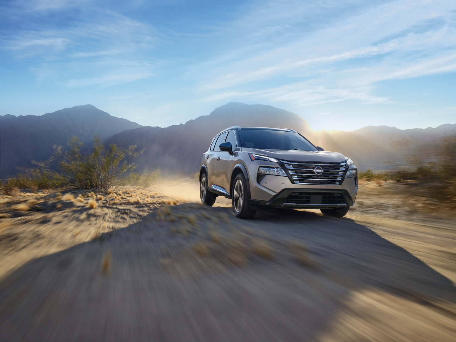 Nissan Rogue driving on closed desert road