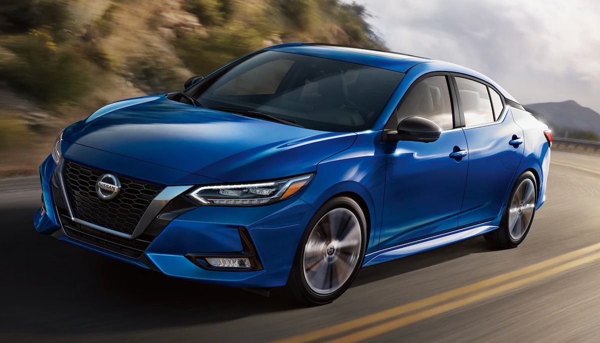 Front view of a blue 2023 Nissan Sentra driving
