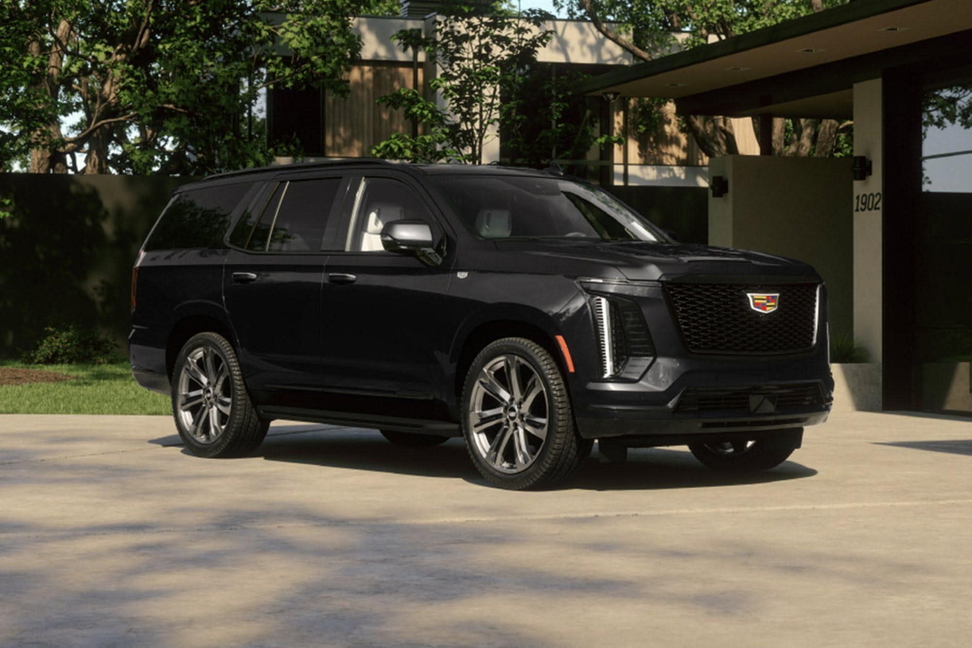 2025 Escalade parked in a driveway side view