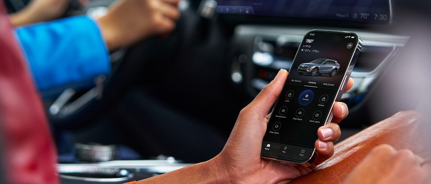 Person using remote controls in the myCadillac mobile app