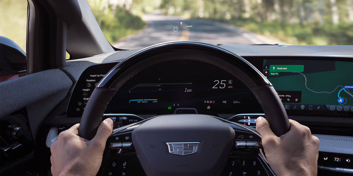 Close up of a Cadillac steering wheel and dashboard
