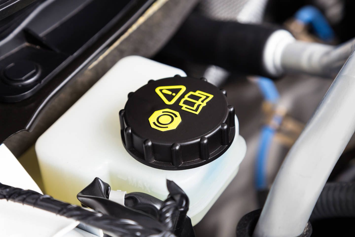 Car engine brake fluid container close-up