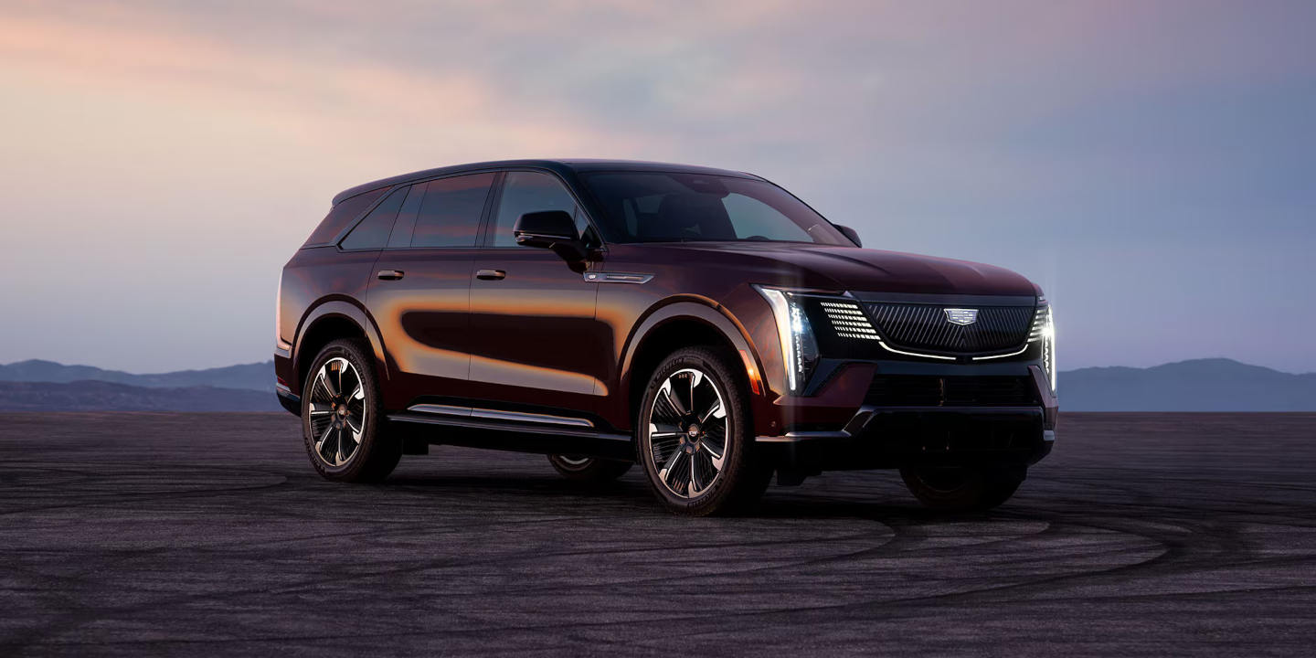 Cadillac SUV parked in the mountains