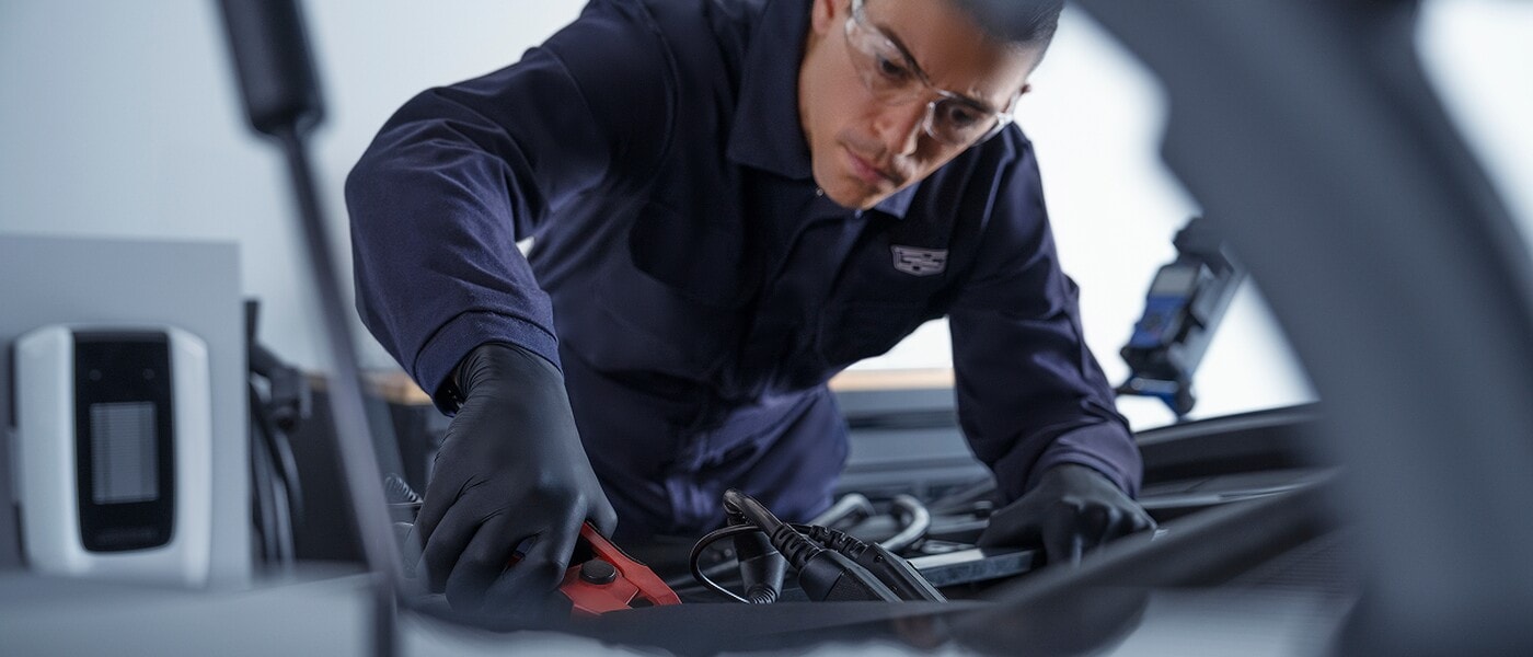Cadillac Certified Service technician working in a service center
