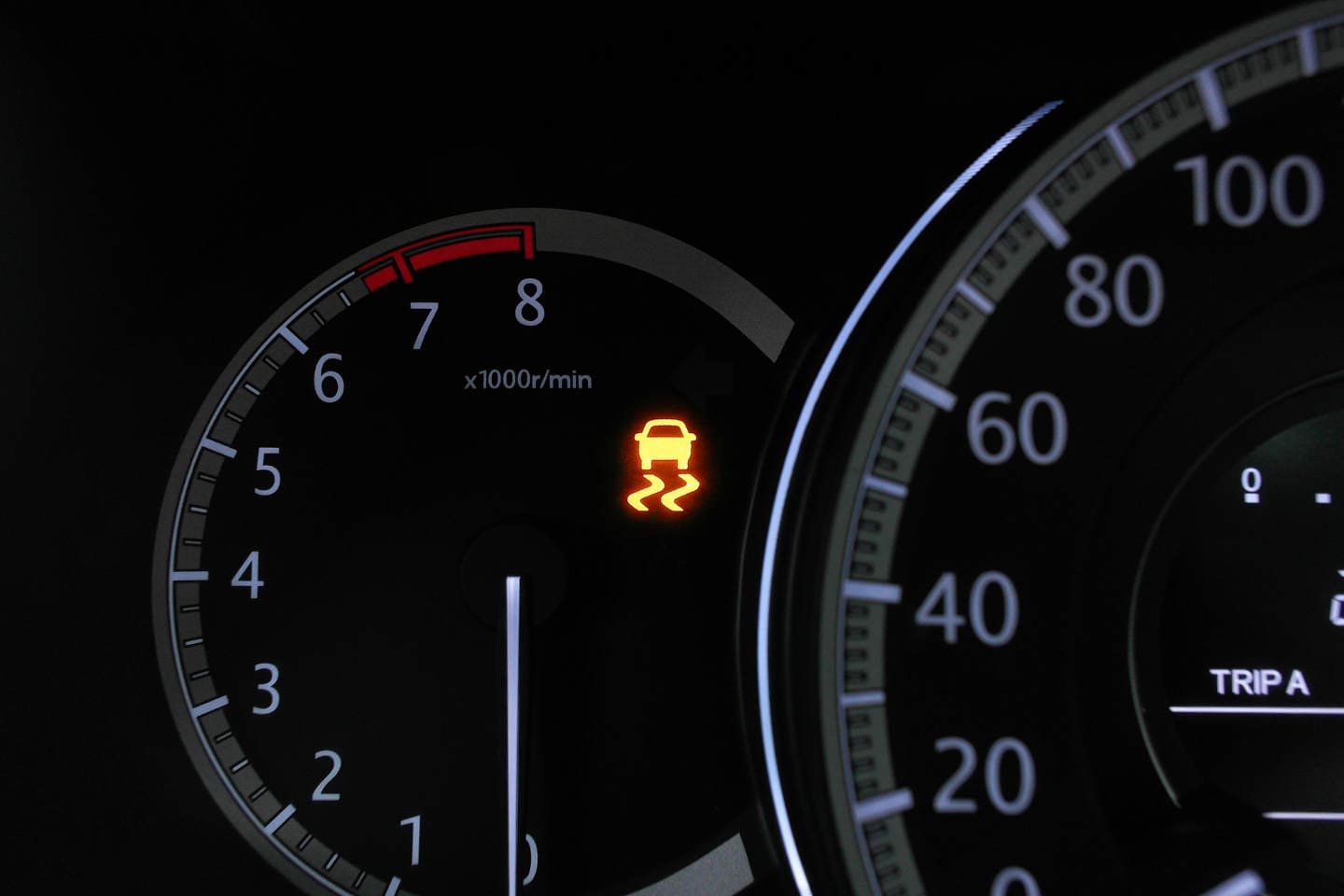 A car traction control system malfunction warning light on the car instrument dashboard