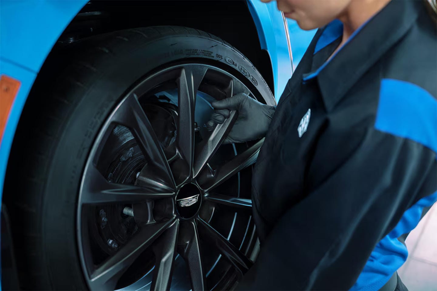 Cadillac&nbsp;technician removing a wheel to start checking brakes