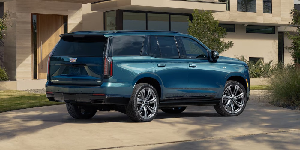 2025 Cadillac Escalade parked in a driveway side view