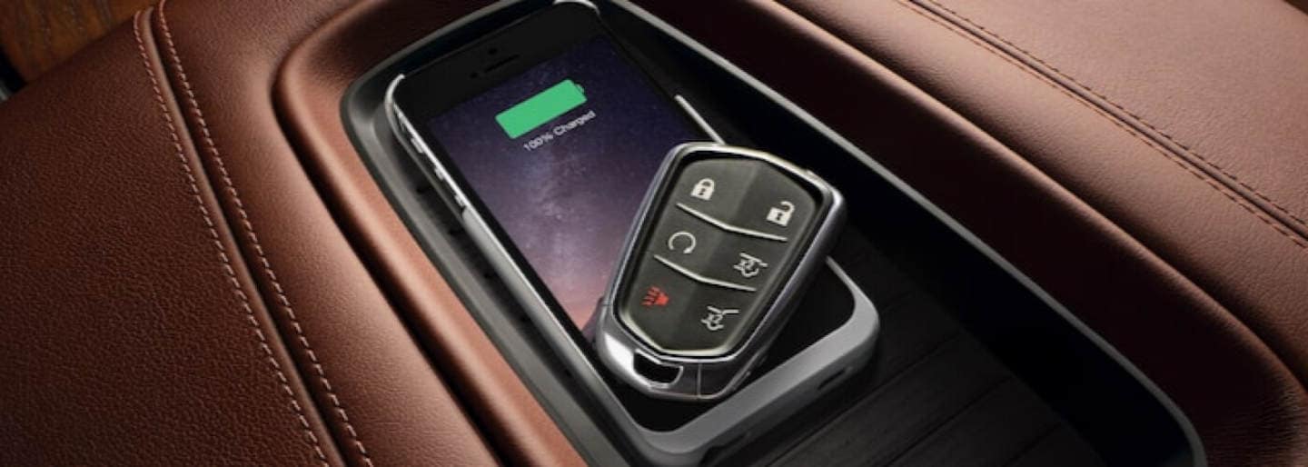 Cadillac key fob on. a center console
