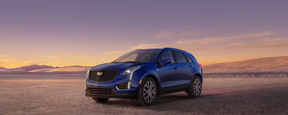 2024 Cadillac XT5 parked in front of a sunset