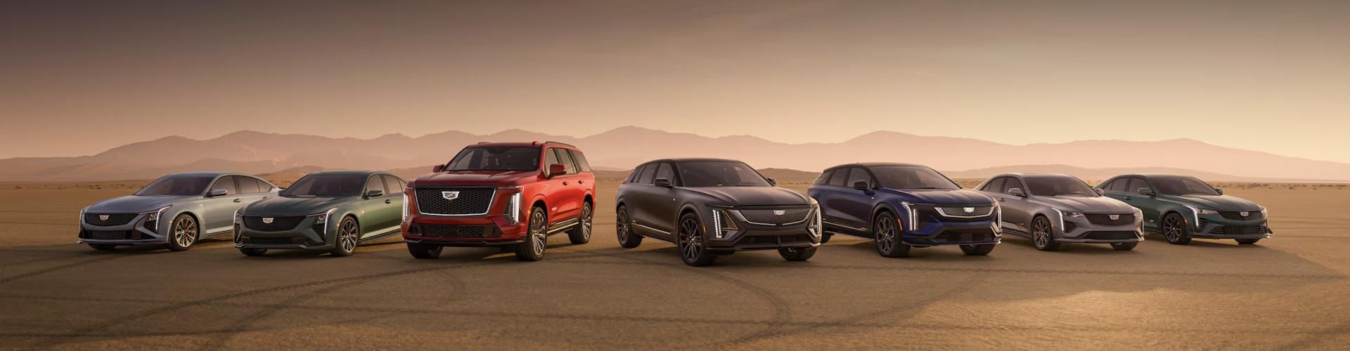 Cadillac line up of vehicles parked in the desert