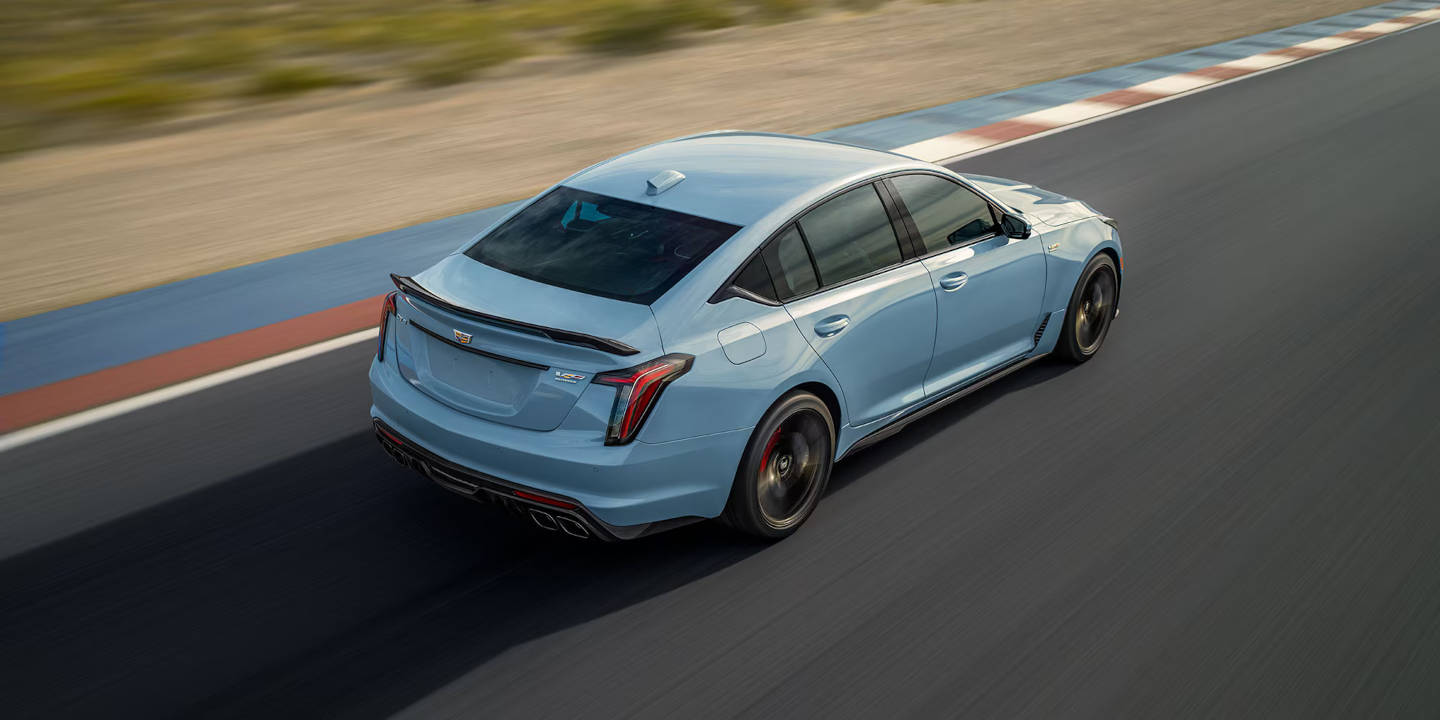 2025 Cadillac CT5-V Blackwing driving around a curve on a racetrack