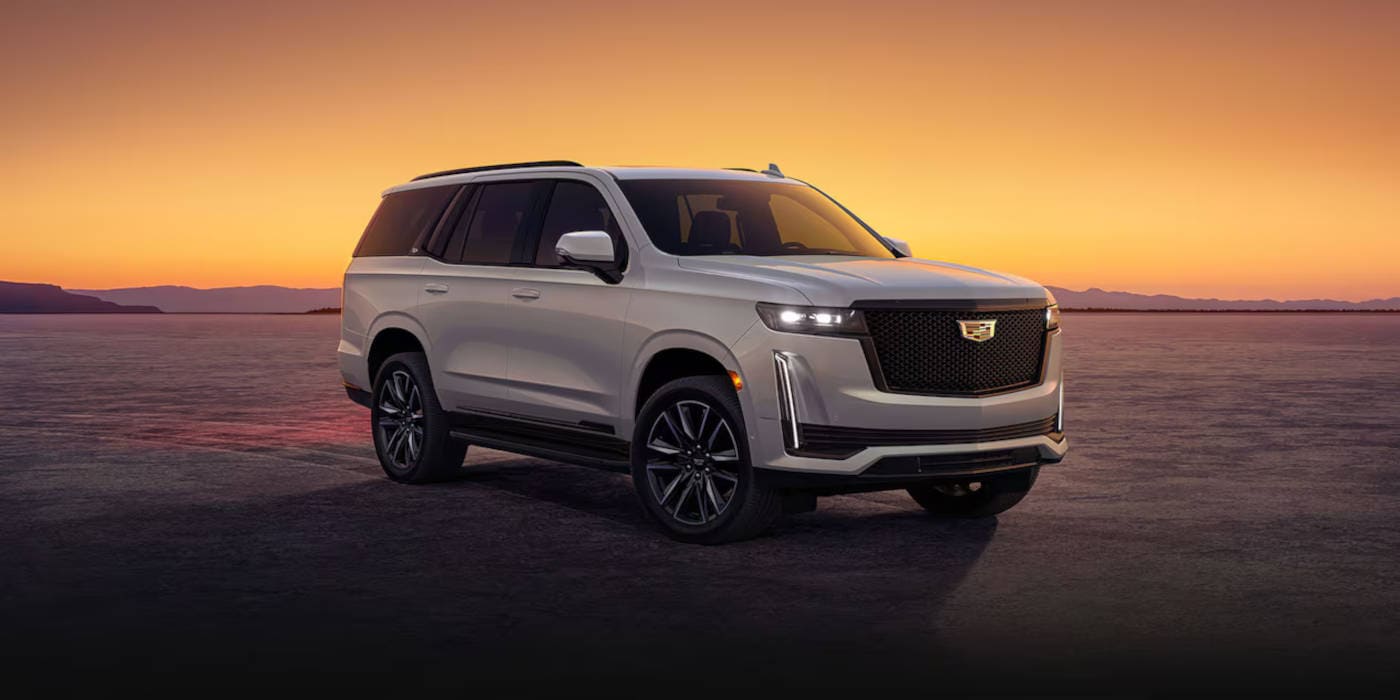 2024 Cadillac Escalade parked with a Sunset in the background.