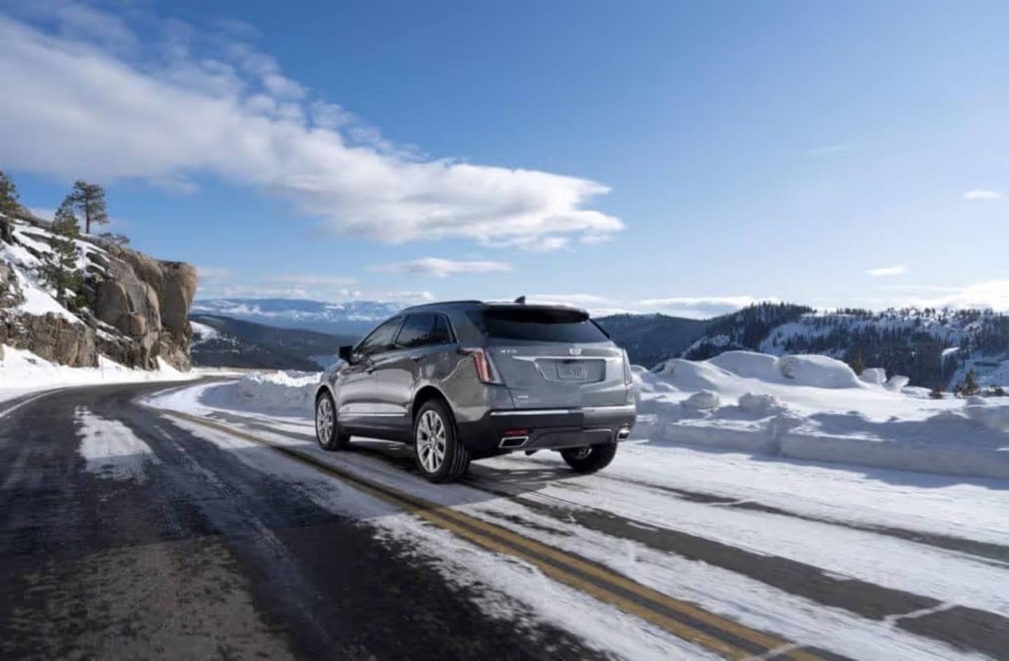 Cadillac driving in the winter