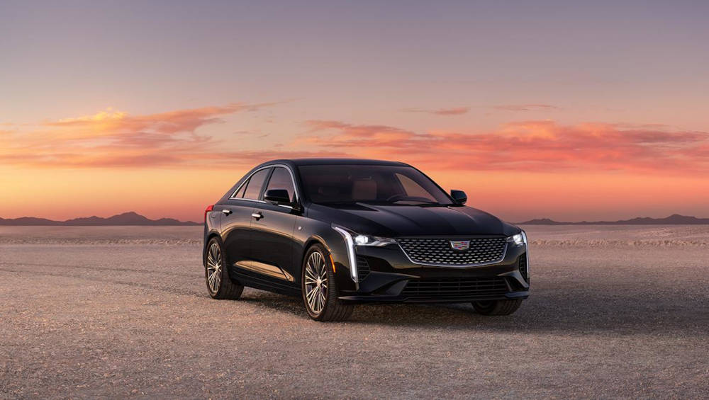 2024 CADILLAC CT4 parked with a sunset in the background