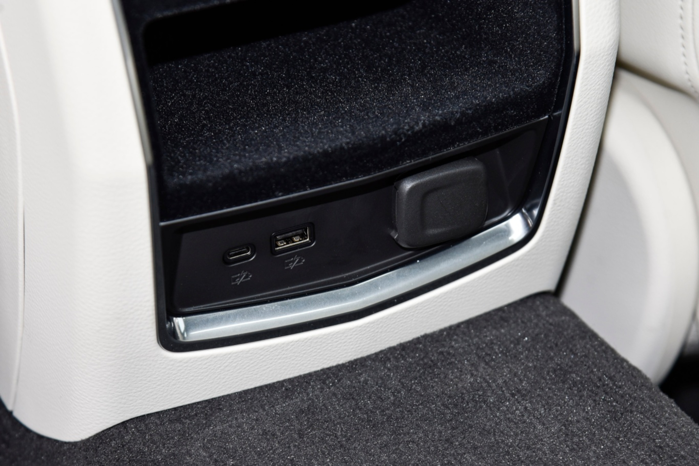 USB-A and USB-C charging ports in a Cadillac CT6 rear console
