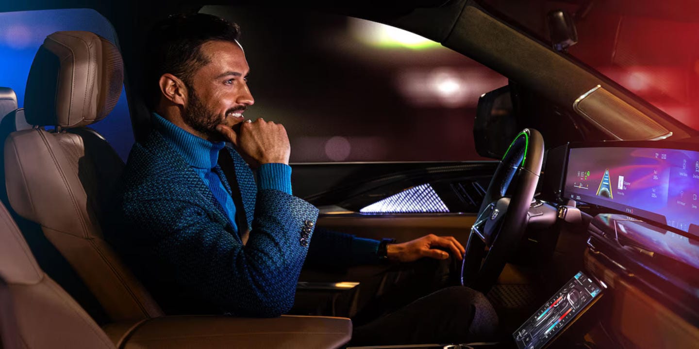 Driver using Cadillac Super Cruise hands-free driving technology