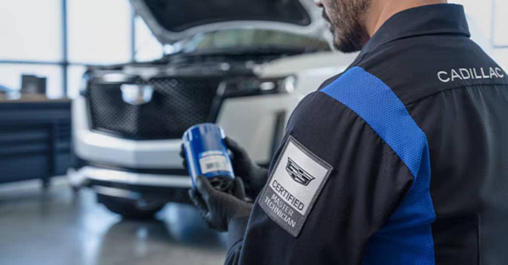 Cadillac Mechanic checking an oil filter