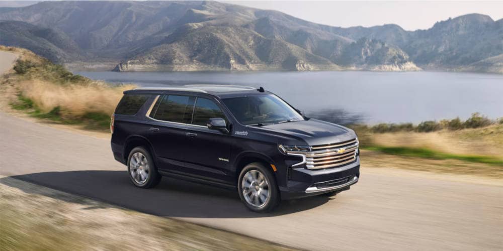 2024 Tahoe driving by a lake