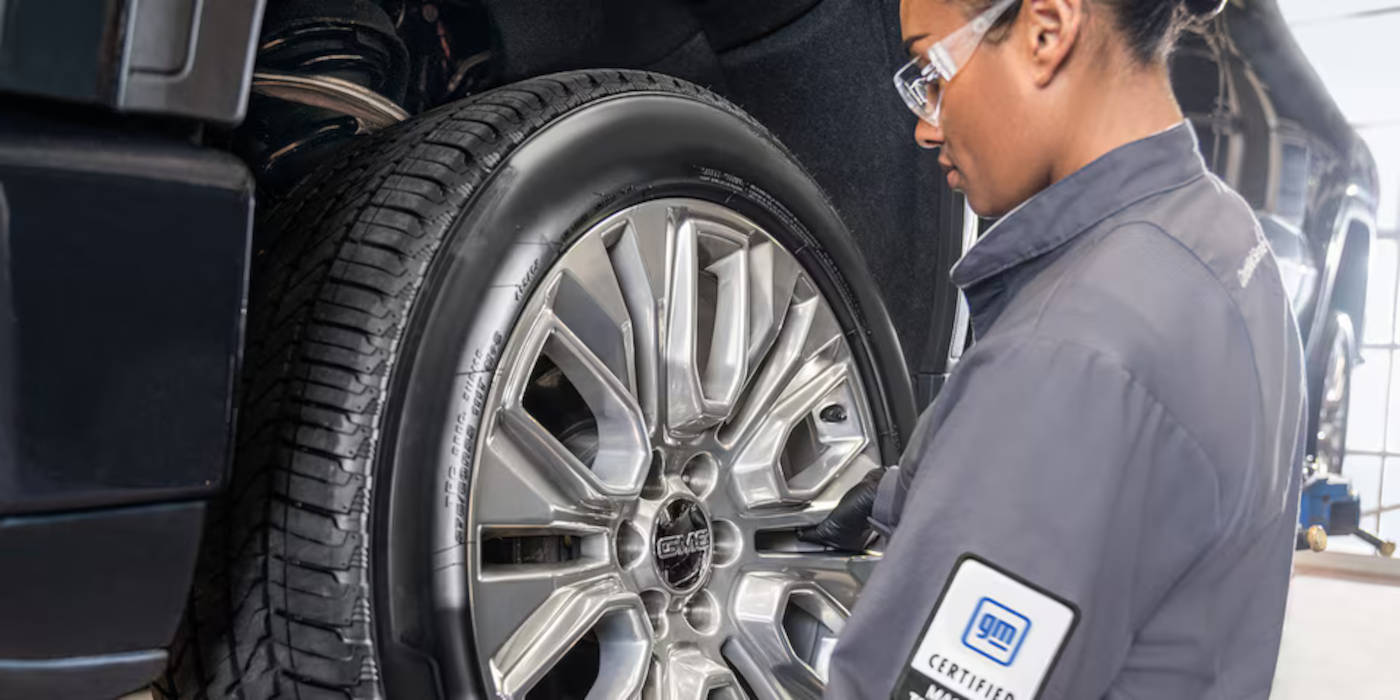Chevy mechanic doing a tire rotation