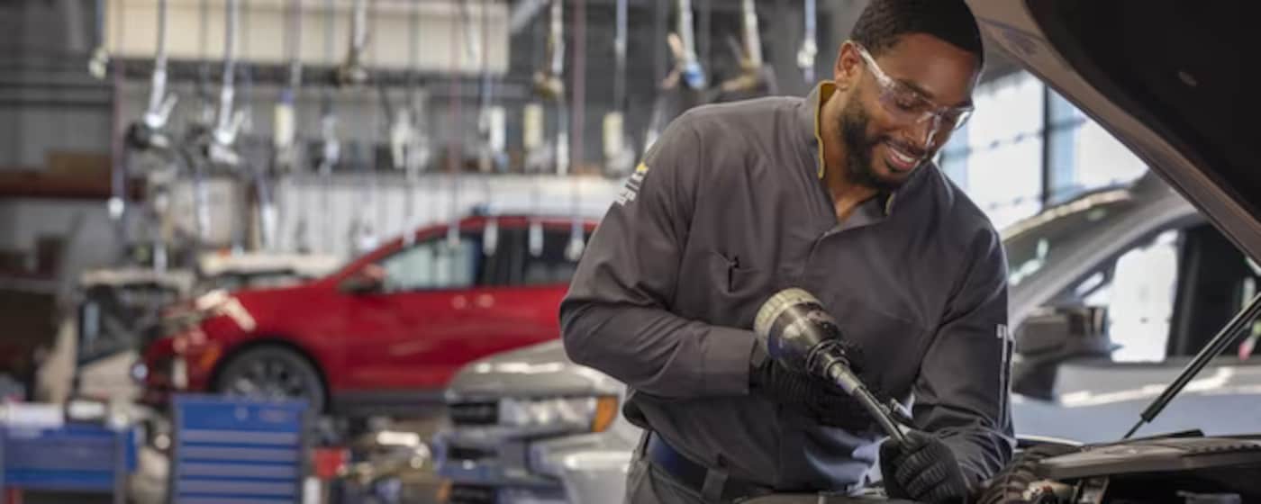 Chevy mechanic doing an oil filter change